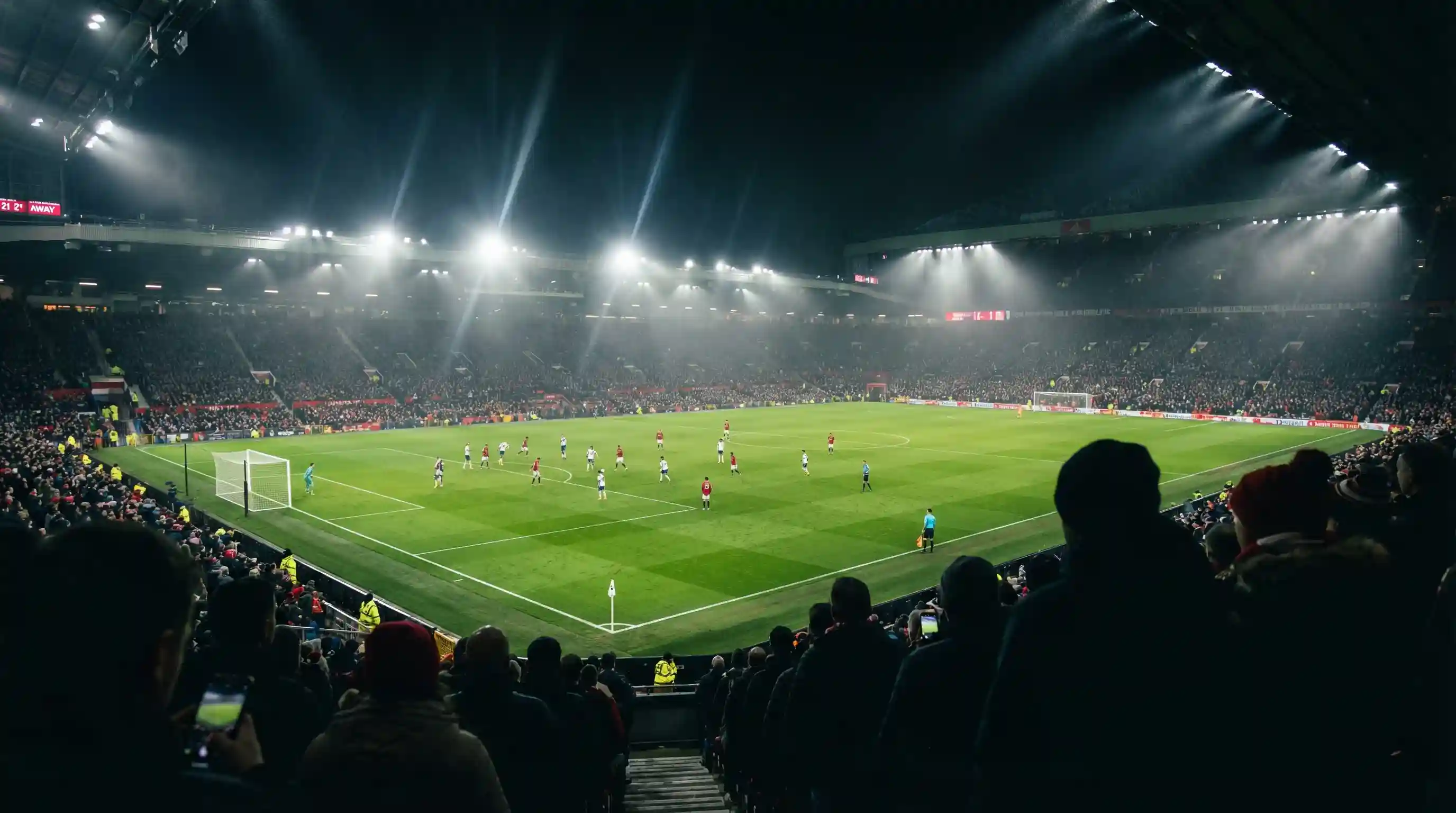 Tifosi allo stadio durante una partita di calcio serale